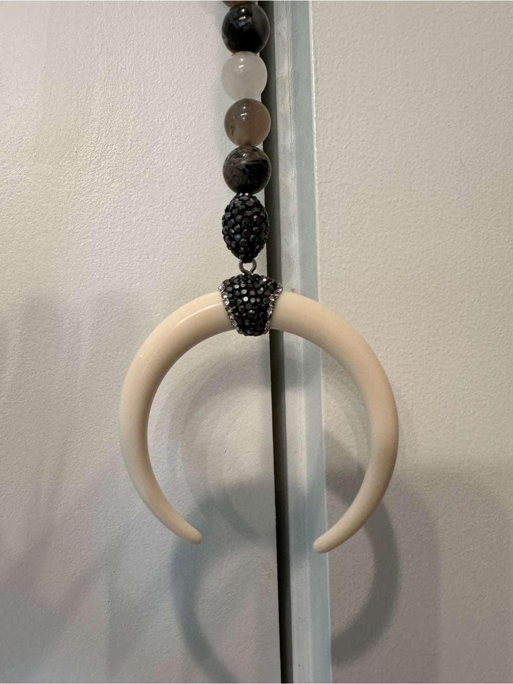 Cream Crescent Wall Hanging with Black Beaded Accent